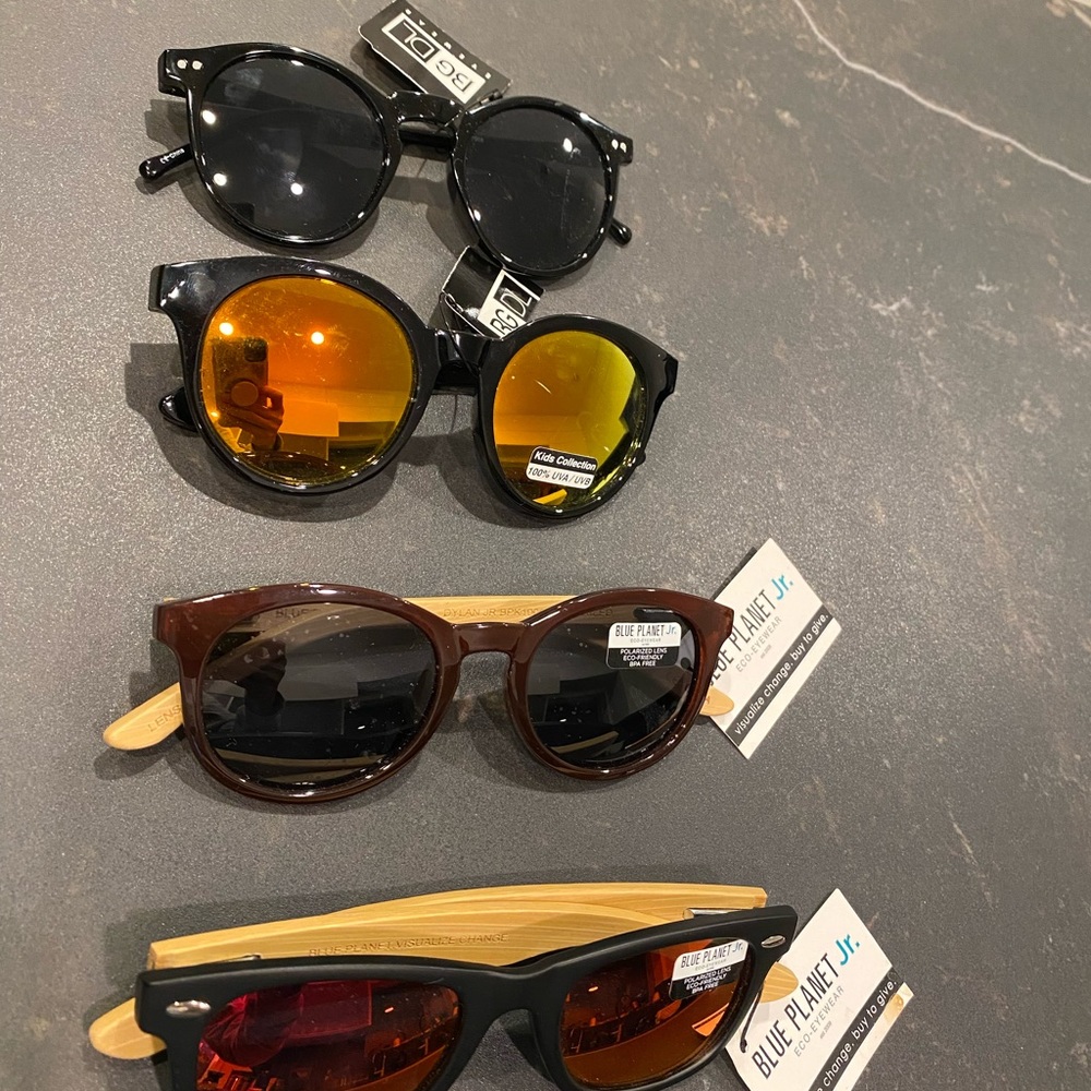 New with tags! 4 pairs of youth high quality sunglasses. Blue planet, Blue Gem.